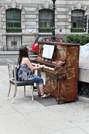 Playing a Tune. London, UK